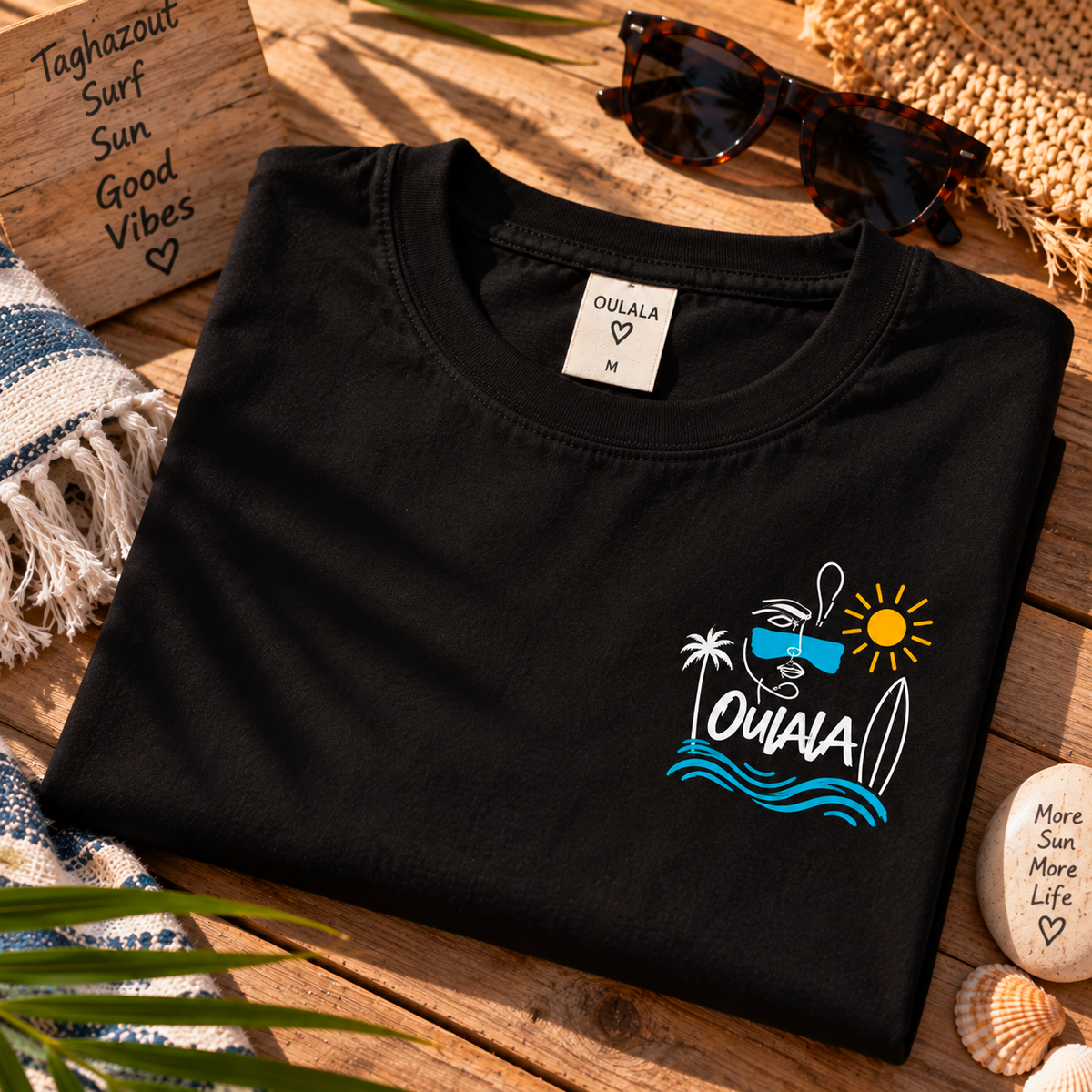 Oulala limited edition beach t-shirt — back view showing the signature Oulala Sun. Sea. Oulala. line-art design