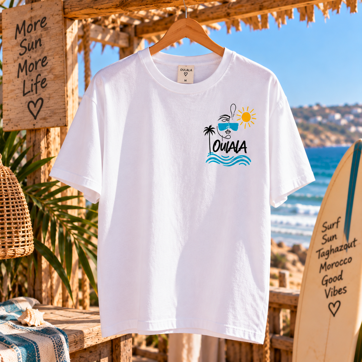 Oulala limited edition beach t-shirt — lifestyle shot worn on the beach in Tamraght, Morocco